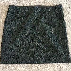 Green tweed skirt.